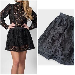 Boutique black lace mini skirt with shorts, size medium